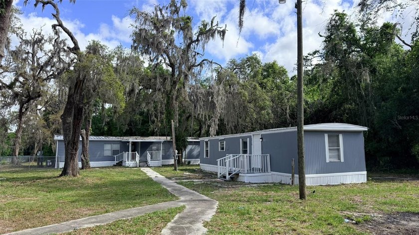 Rare opportunity in Moon Lake Estates!! This unique property - Beach Home for sale in New Port Richey, Florida on Beachhouse.com