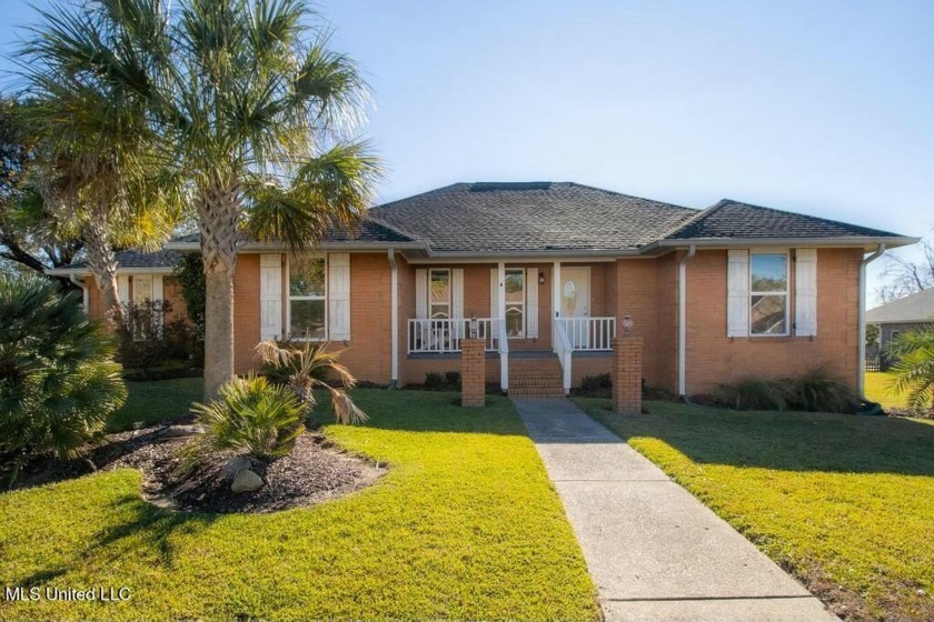 Beautiful three-bedroom home featuring a saltwater pool with a - Beach Home for sale in Gulfport, Mississippi on Beachhouse.com