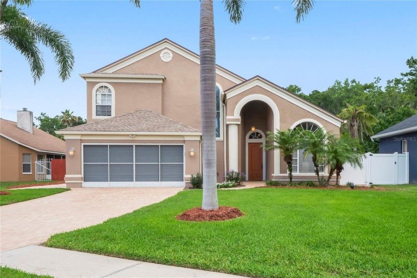 Welcome to your dream retreat! This spacious 2-story home offers - Beach Home for sale in Tarpon Springs, Florida on Beachhouse.com