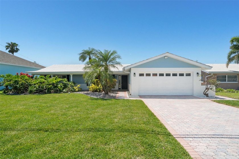 Gracefully positioned along the serene waterfront of Treasure - Beach Home for sale in Treasure Island, Florida on Beachhouse.com