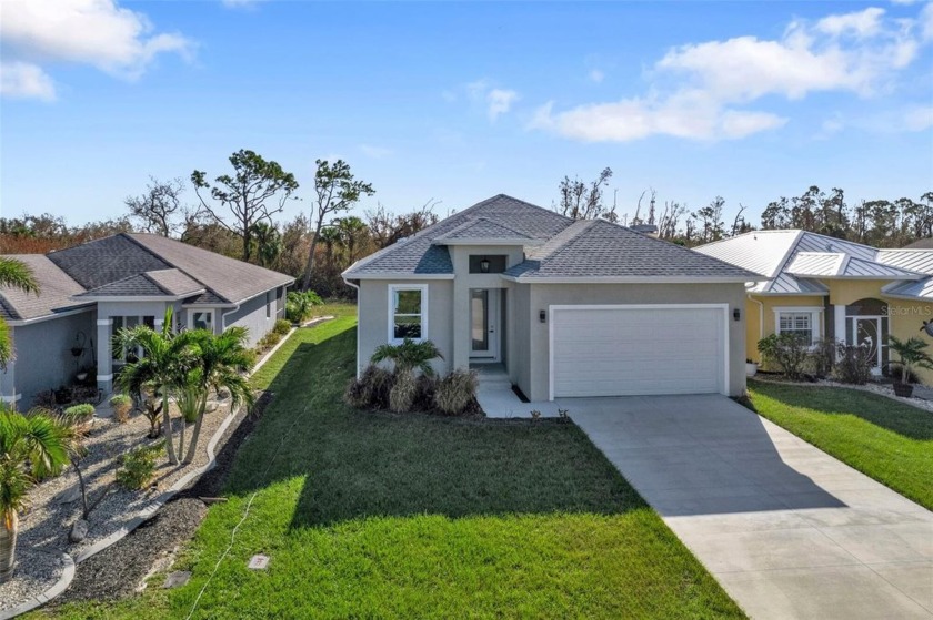 Discover this stunning BRAND-NEW CONSTRUCTION home loaded with - Beach Home for sale in Port Charlotte, Florida on Beachhouse.com