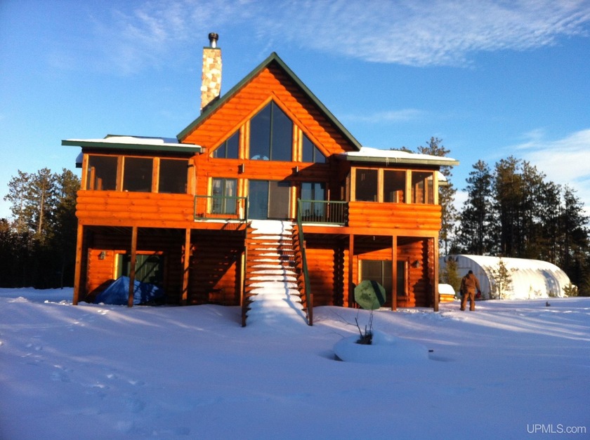Very high quality log home on 41.6 acres with 294' of Rice Lake - Beach Home for sale in Lake Linden, Michigan on Beachhouse.com