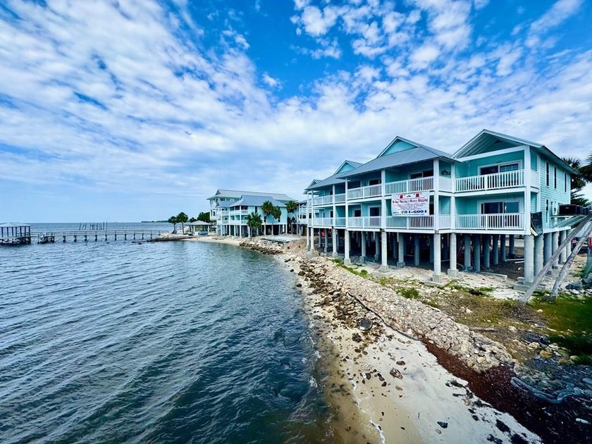 Perched along the shimmering shoreline of Cedar Key, this - Beach Condo for sale in Cedar Key, Florida on Beachhouse.com