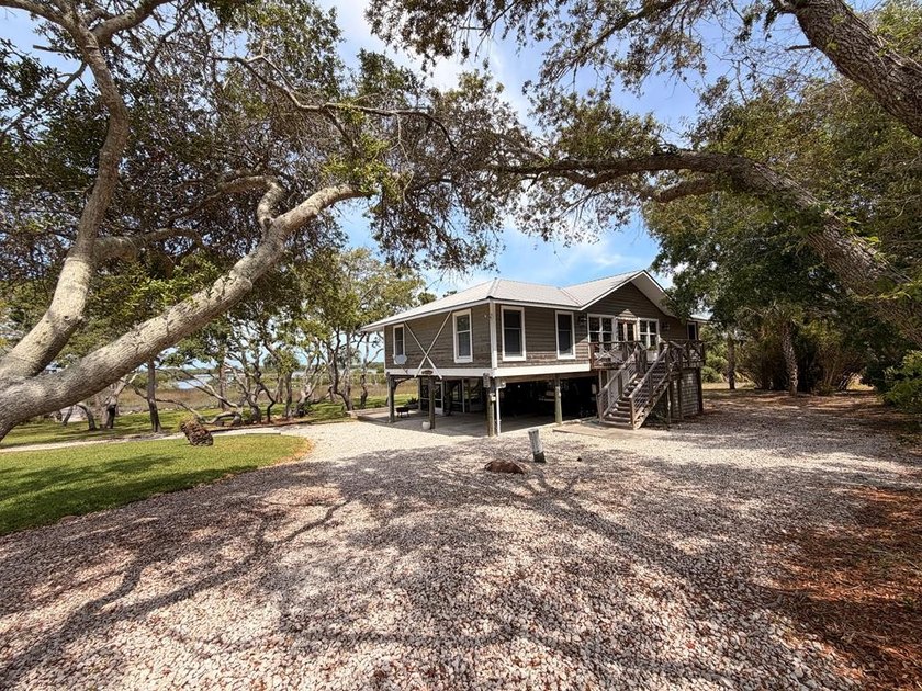 Tucked away at the end of a peaceful, quiet street, this - Beach Home for sale in Cedar Key, Florida on Beachhouse.com