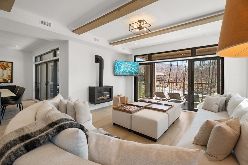 Beautiful single-level 3-bedroom condo offering comfort and - Beach Condo for sale in Mont-Tremblant, Quebec on Beachhouse.com
