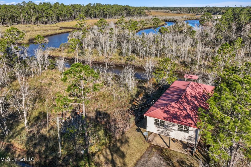 Escape to your own private oasis at this cozy waterfront camp - Beach Home for sale in Bay Saint Louis, Mississippi on Beachhouse.com