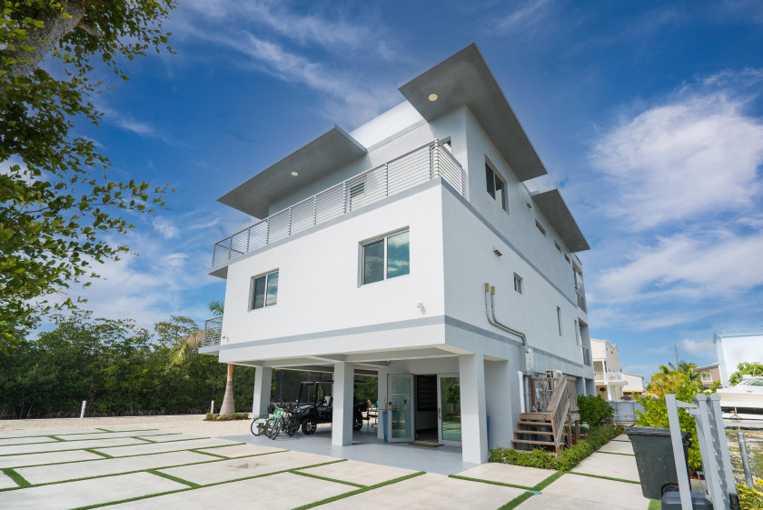 Waterfront beauty! Built in 2020 this modern all CBS home is - Beach Home for sale in Key Largo, Florida on Beachhouse.com