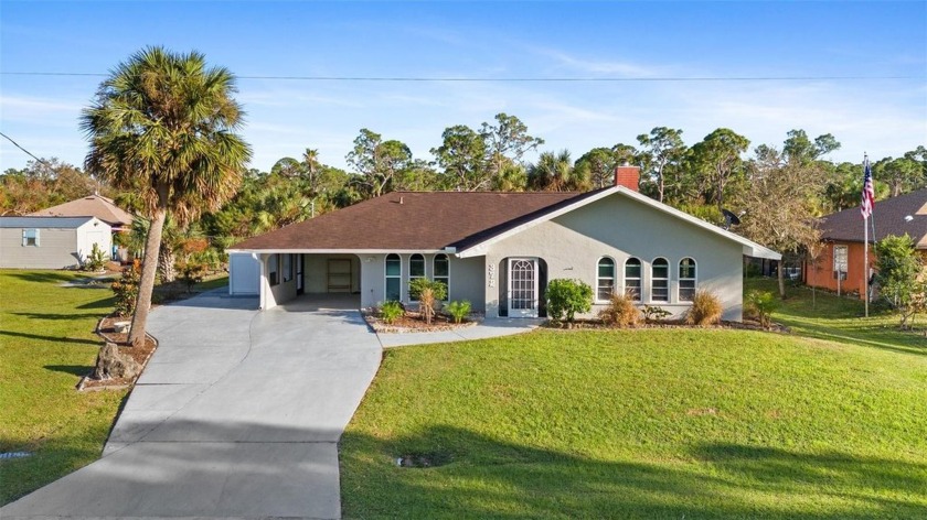 WATERFRONT living can be yours with this double-lot property - Beach Home for sale in Port Charlotte, Florida on Beachhouse.com