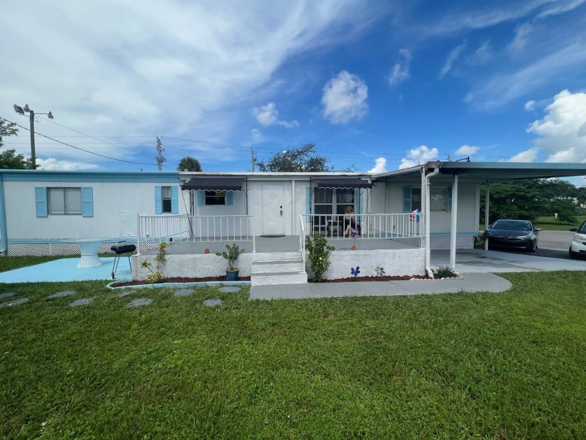 Welcome to this charming 2-bedroom, 2-bathroom mobile home that - Beach Home for sale in West Palm Beach, Florida on Beachhouse.com