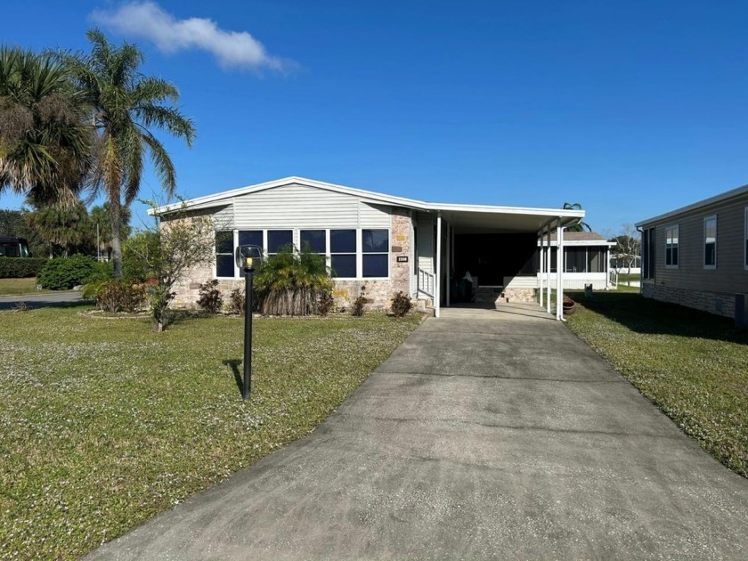 This spacious 2x2 sits on a LARGE corner lot by the lake! The - Beach Home for sale in Melbourne, Florida on Beachhouse.com