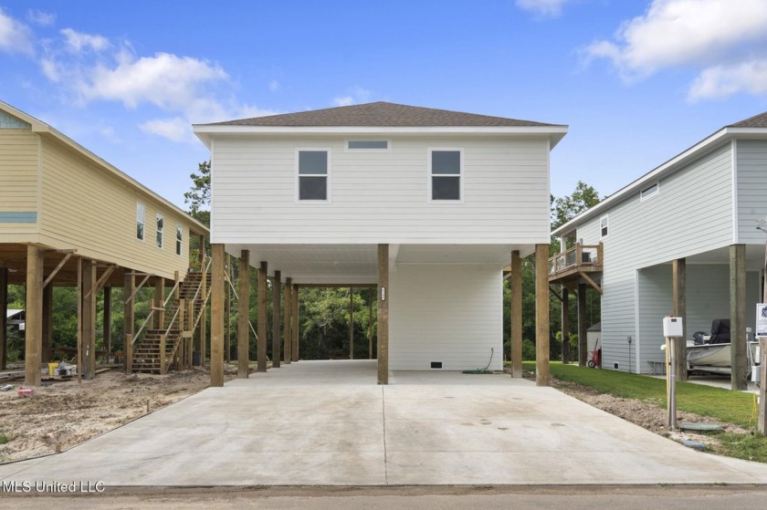 This beautiful and thoughtfully designed 3 bed, 2 full bath home - Beach Home for sale in Bay Saint Louis, Mississippi on Beachhouse.com