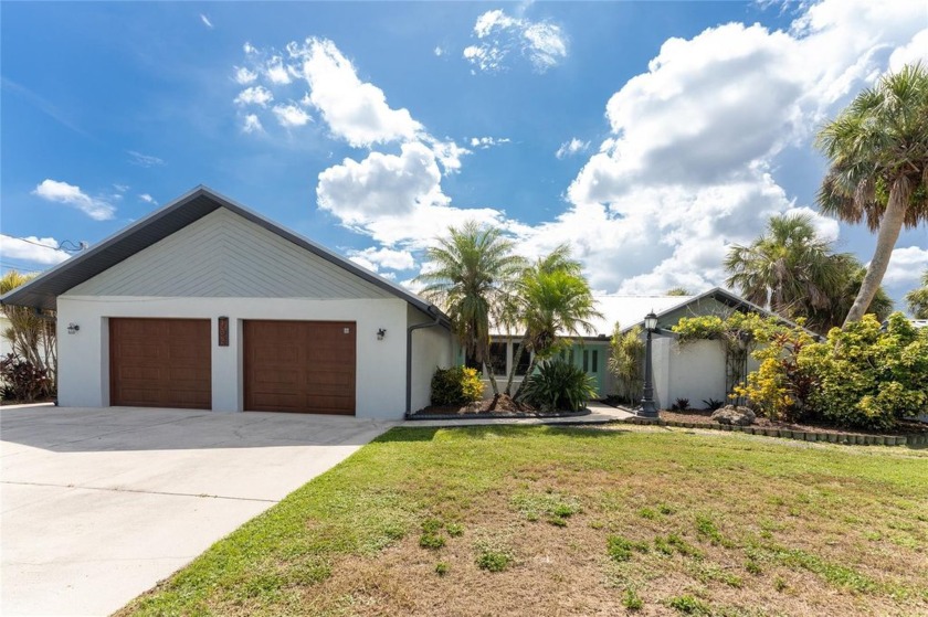 Live the Florida Dream! Exquisite 3 bedroom, 2 bath home with a - Beach Home for sale in Port Charlotte, Florida on Beachhouse.com