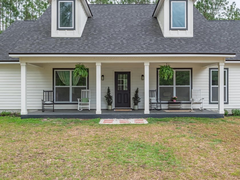Where modern comfort meets farmhouse charm, this 2.38-acre - Beach Home for sale in Crawfordville, Florida on Beachhouse.com