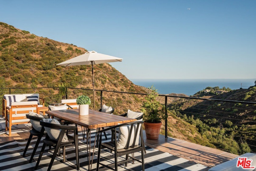 Tucked away on two beautifully landscaped lots totaling almost - Beach Home for sale in Malibu, California on Beachhouse.com