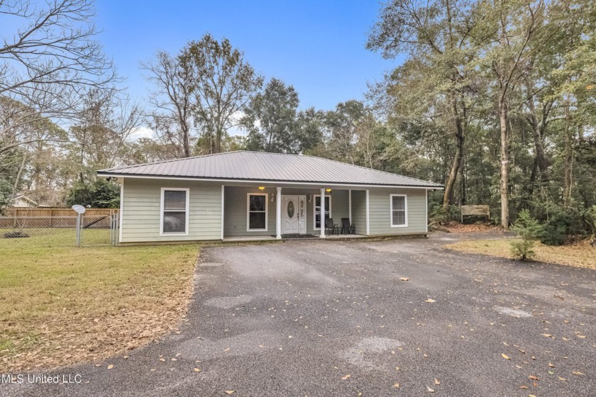 Discover this stunning 3-bedroom, 2-bath home nestled in the - Beach Home for sale in Ocean Springs, Mississippi on Beachhouse.com