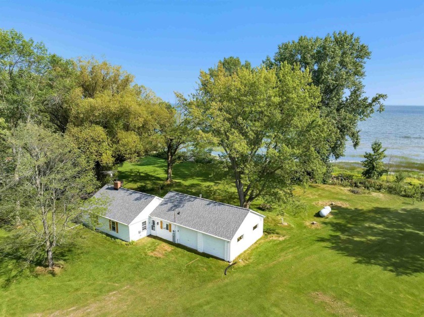 Featuring 86 feet of shoreline on the bay, this 2 bed, 1 bath - Beach Home for sale in Oconto, Wisconsin on Beachhouse.com