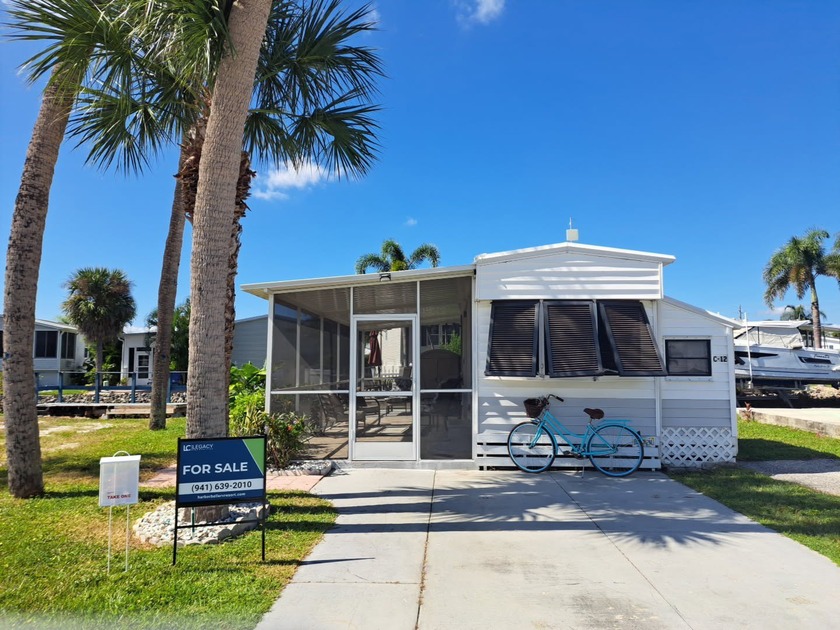 Discover affordable waterfront living in this 34' x 12' travel - Beach Home for sale in Punta Gorda, Florida on Beachhouse.com