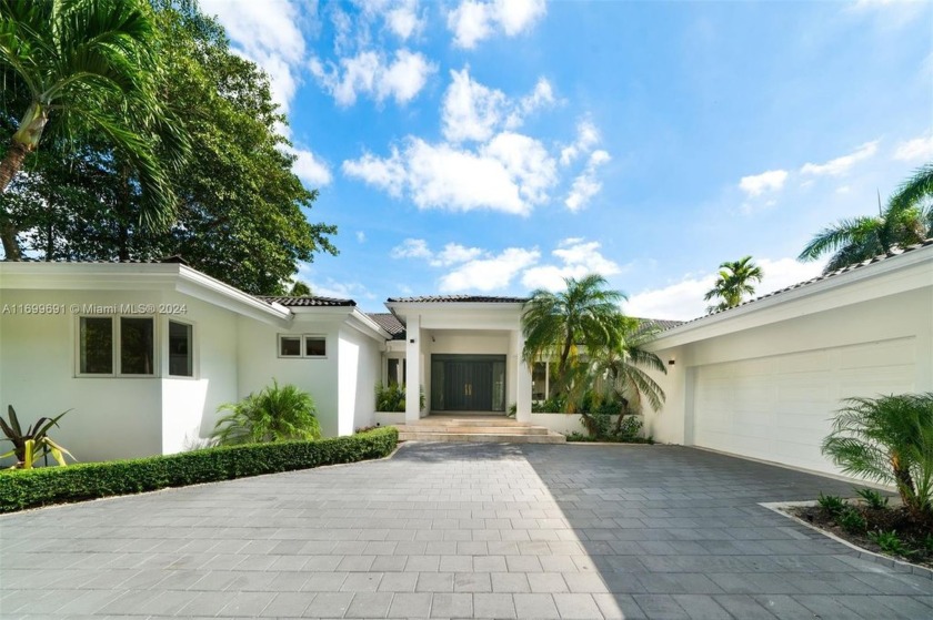 Discover this stunning contemporary waterfront home in Cocoplum - Beach Home for sale in Coral Gables, Florida on Beachhouse.com