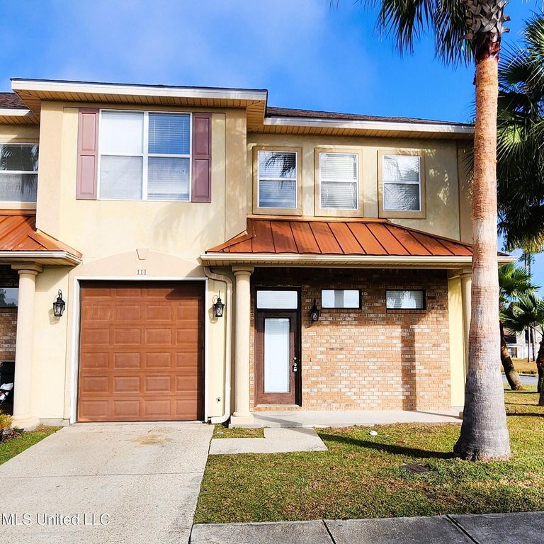 This townhouse offers convenience and style. The primary bedroom - Beach Townhome/Townhouse for sale in Ocean Springs, Mississippi on Beachhouse.com