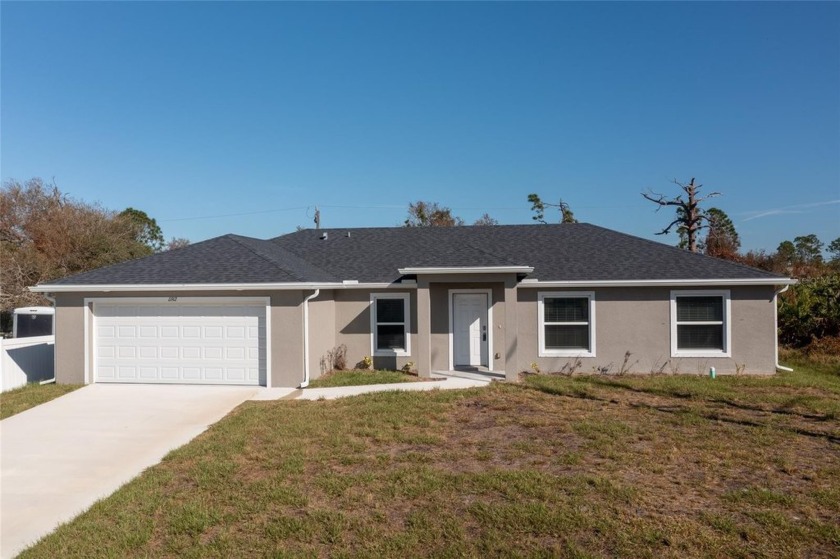 NEW CONSTRUCTION! MOVE-IN-READY! GREAT INVESTMENT OPPORTUNITY OR - Beach Home for sale in Port Charlotte, Florida on Beachhouse.com