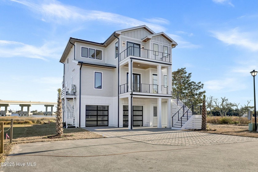 Welcome to your dream waterfront oasis! Built by Channel Marker - Beach Home for sale in Surf City, North Carolina on Beachhouse.com