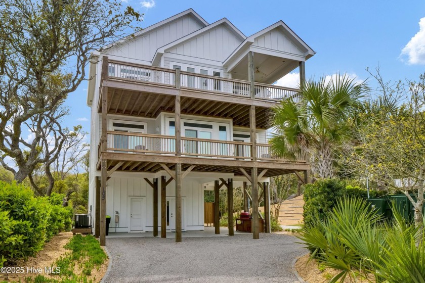 This beautiful custom home was built in 2022. The property has - Beach Home for sale in Surf City, North Carolina on Beachhouse.com