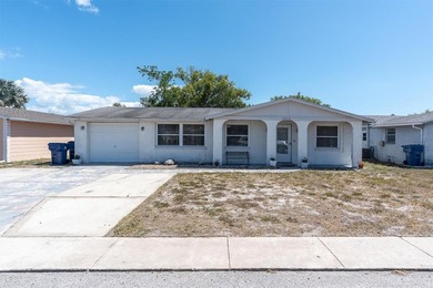 Beach Home For Sale in Holiday, Florida