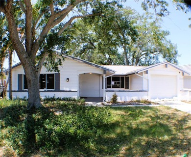 Beach Home For Sale in Holiday, Florida