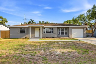 Beach Home For Sale in Kenneth City, Florida