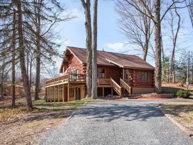 Amazing full log home on over 7 acres of rolling, wooded land - Beach Home for sale in Free Soil, Michigan on Beachhouse.com