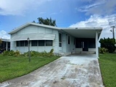 Beach Home For Sale in Barefoot Bay, Florida