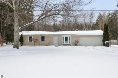 Beach Home For Sale in Kewadin, Michigan