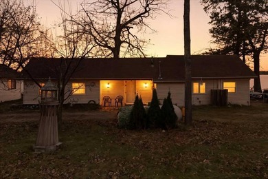 Beach Home For Sale in Carp Lake, Michigan
