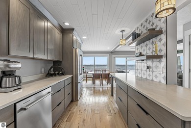 Beach Home For Sale in Kewadin, Michigan