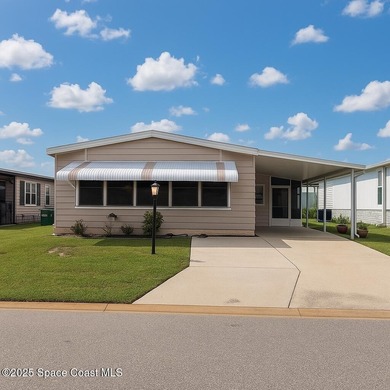 Beach Home For Sale in Barefoot Bay, Florida