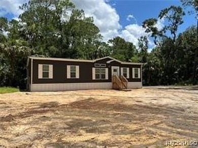 Beach Home For Sale in Inglis, Florida