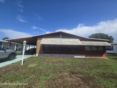 Beach Home For Sale in Barefoot Bay, Florida