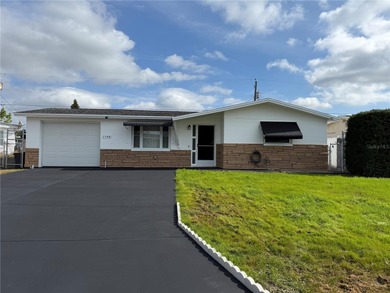 Beach Home For Sale in Holiday, Florida