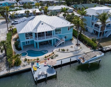 Beach Home For Sale in Holmes Beach, Florida
