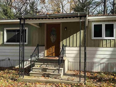 Beach Home For Sale in Carp Lake, Michigan