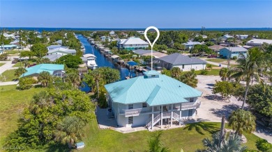 Beach Home For Sale in Bokeelia, Florida