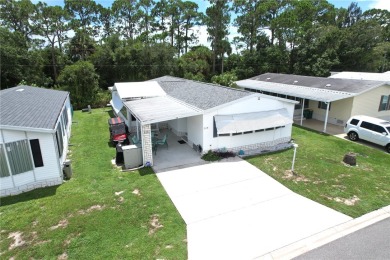 Beach Home For Sale in Barefoot Bay, Florida