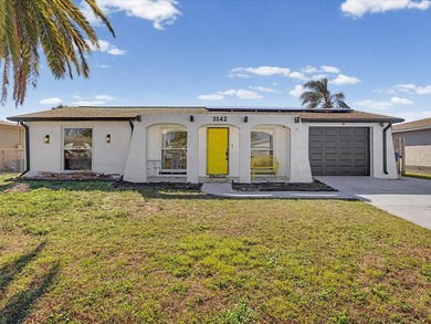 Beach Home For Sale in Holiday, Florida