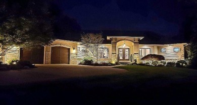 This custom-built, executive home is located within the Sand - Beach Home for sale in Holland, Michigan on Beachhouse.com